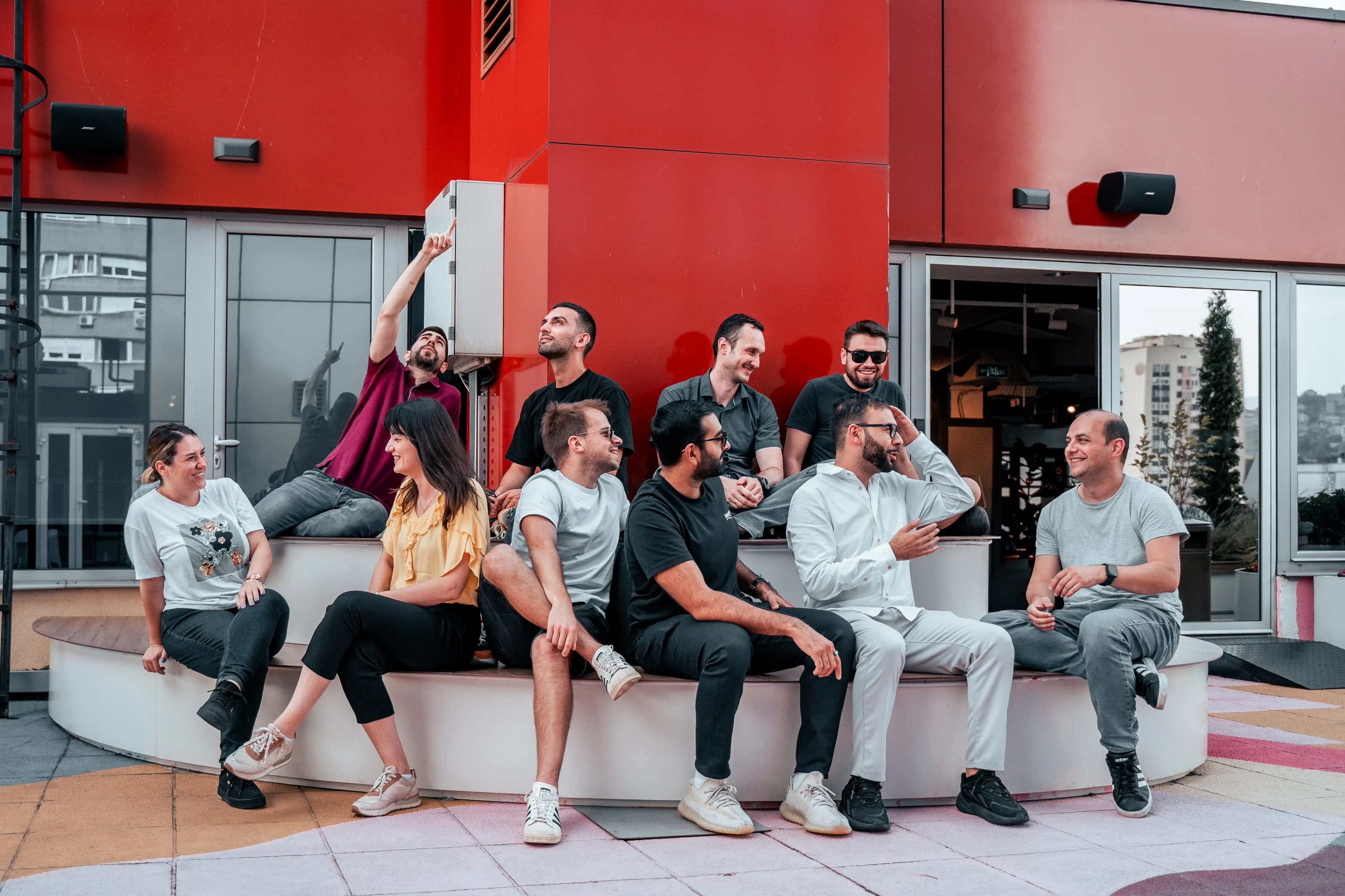 Product designer and software engineer posing together during an afterwork gathering at Ministry of Programming.